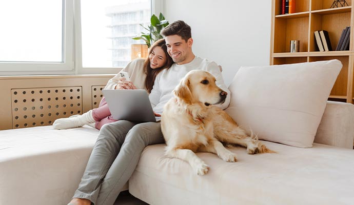 Happy family relaxing on a freshly cleaned sofa